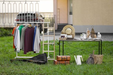 Photo of Many different items selling in yard. Garage sale