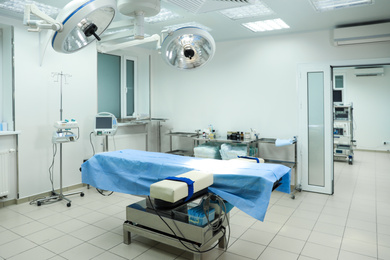 Photo of Surgery room interior with modern equipment in clinic