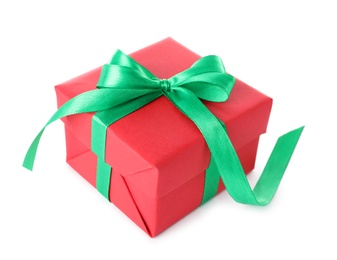 Christmas gift box decorated with ribbon bow on white background