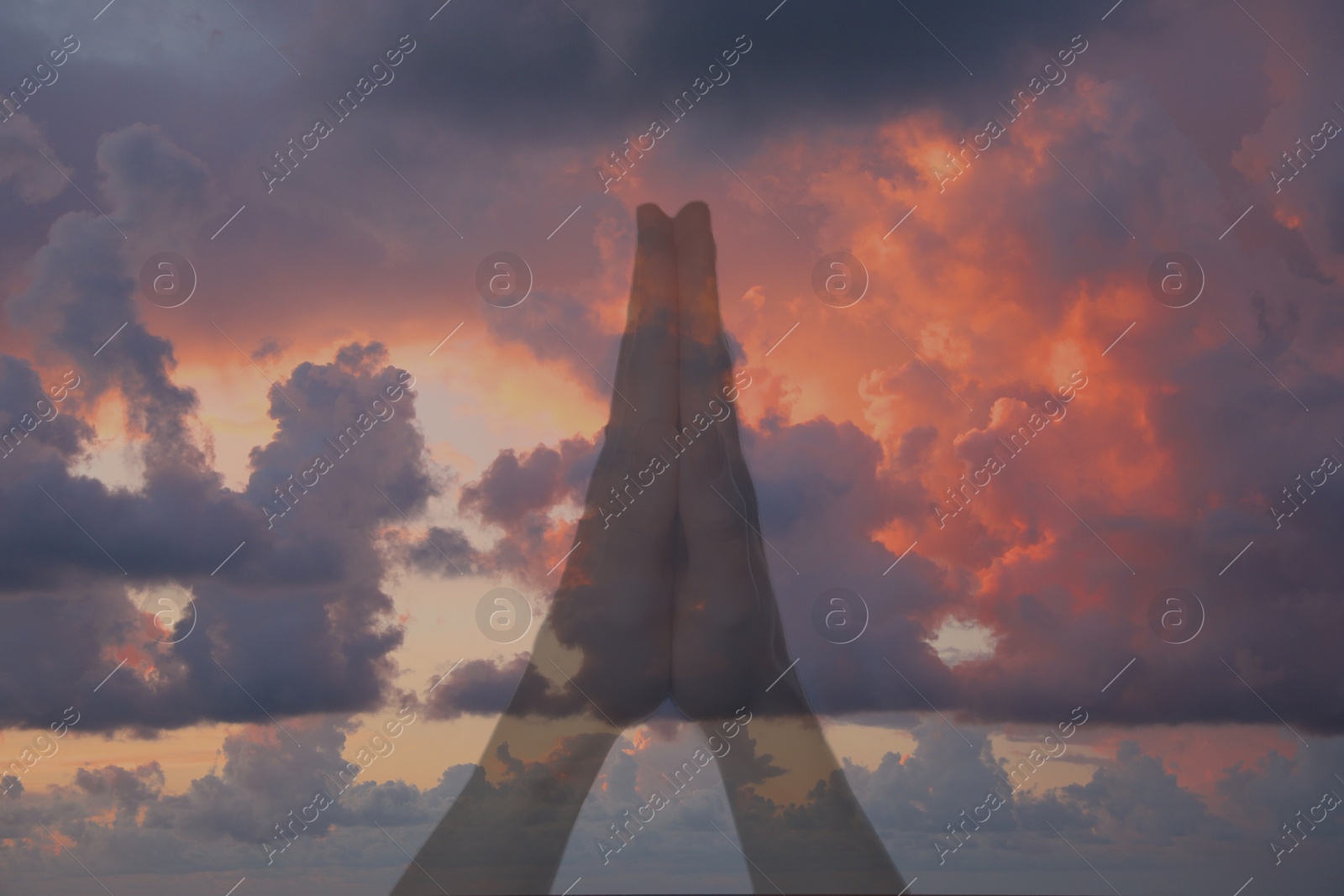 Image of Religion. Christian woman praying and sky, double exposure