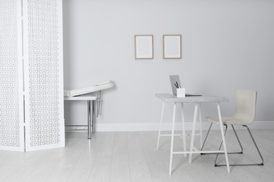 Photo of Doctor's office interior with modern workplace in clinic