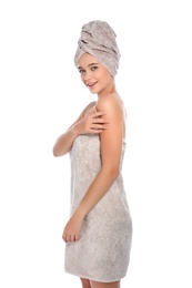 Portrait of young pretty woman with towels on white background