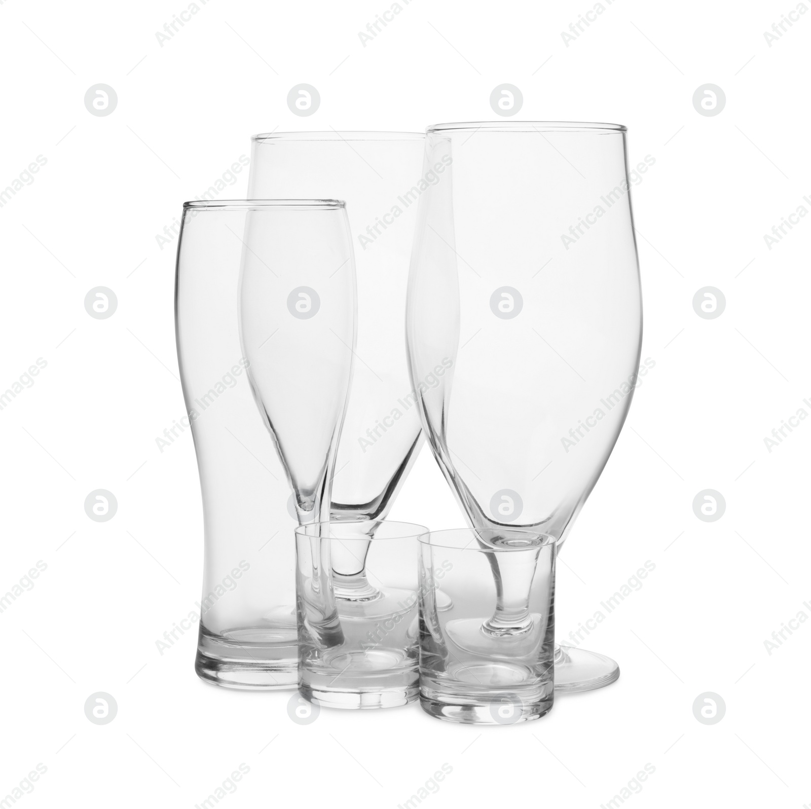 Photo of Different elegant empty glasses isolated on white