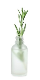 Photo of Bottle of essential oil and rosemary isolated on white