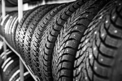 Car tires in automobile service center, closeup