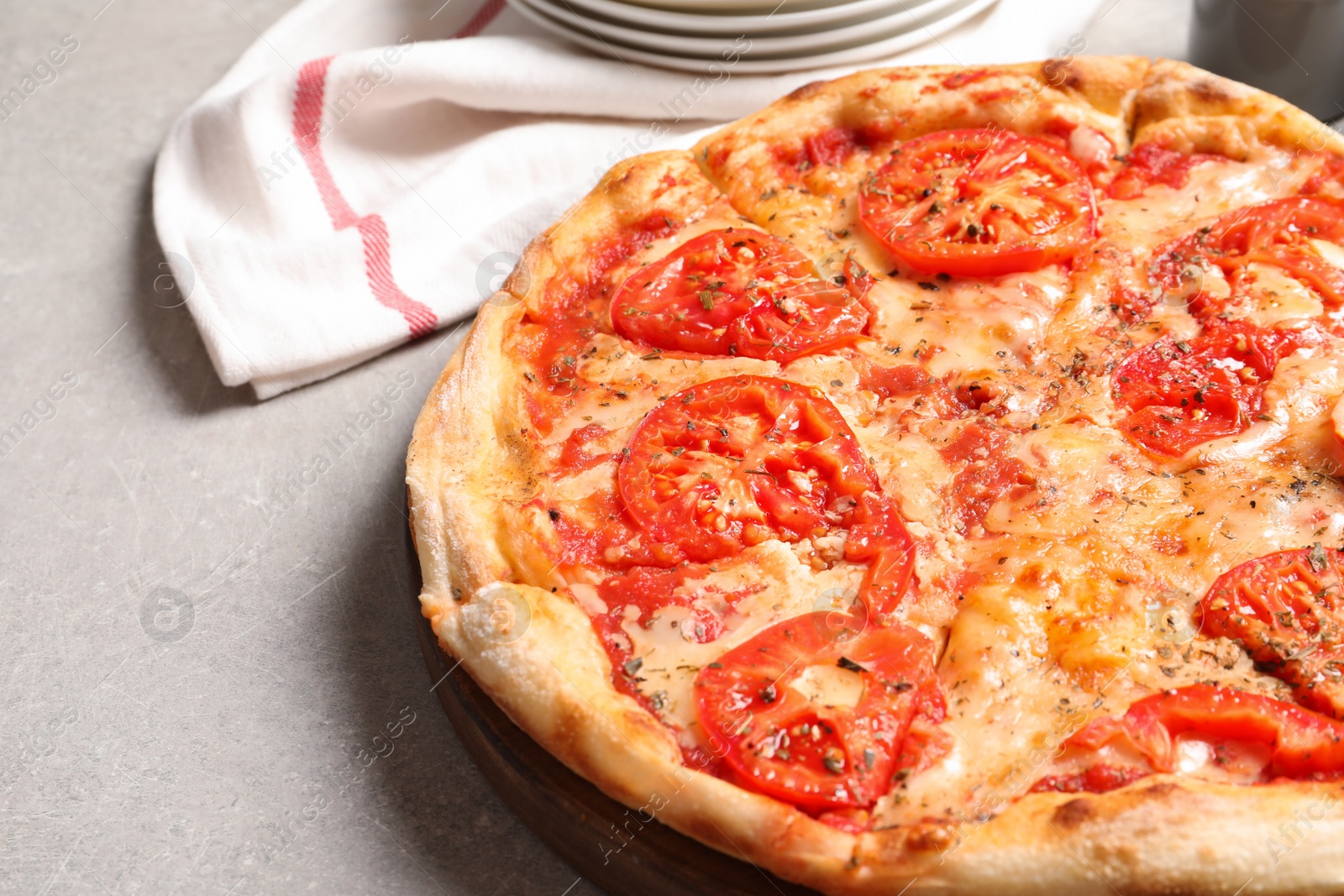 Photo of Hot cheese pizza Margherita on grey table