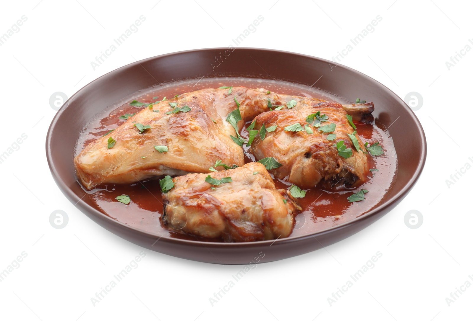 Photo of Tasty cooked rabbit meat with sauce and parsley isolated on white