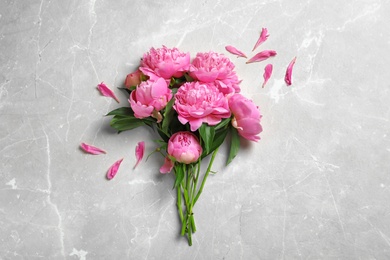 Photo of Beautiful fragrant peony flowers on color background