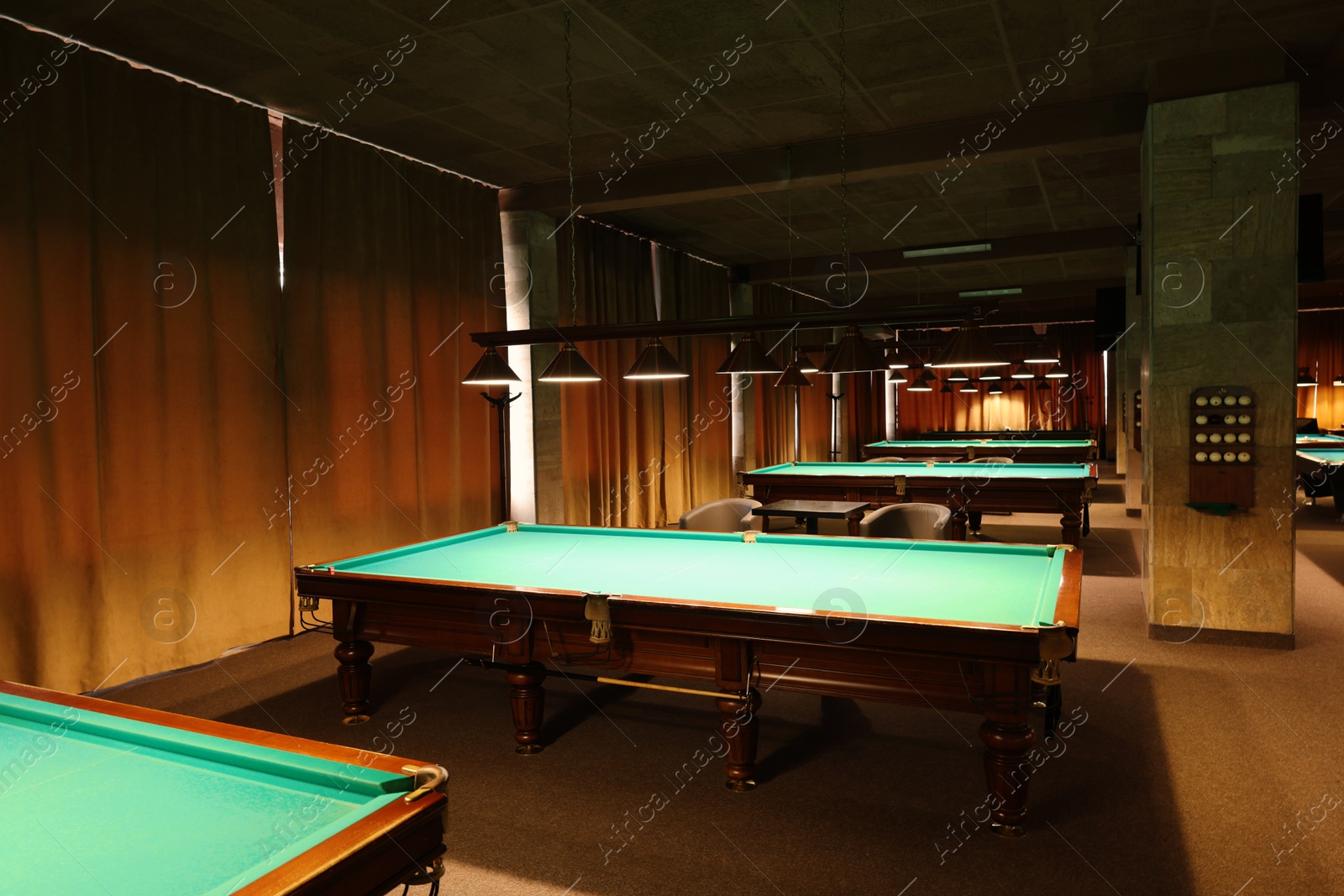 Photo of Empty green billiard tables in club. Pool Game