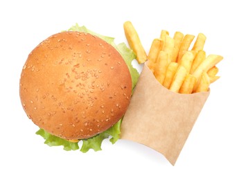 Photo of French fries and tasty burger on white background, top view