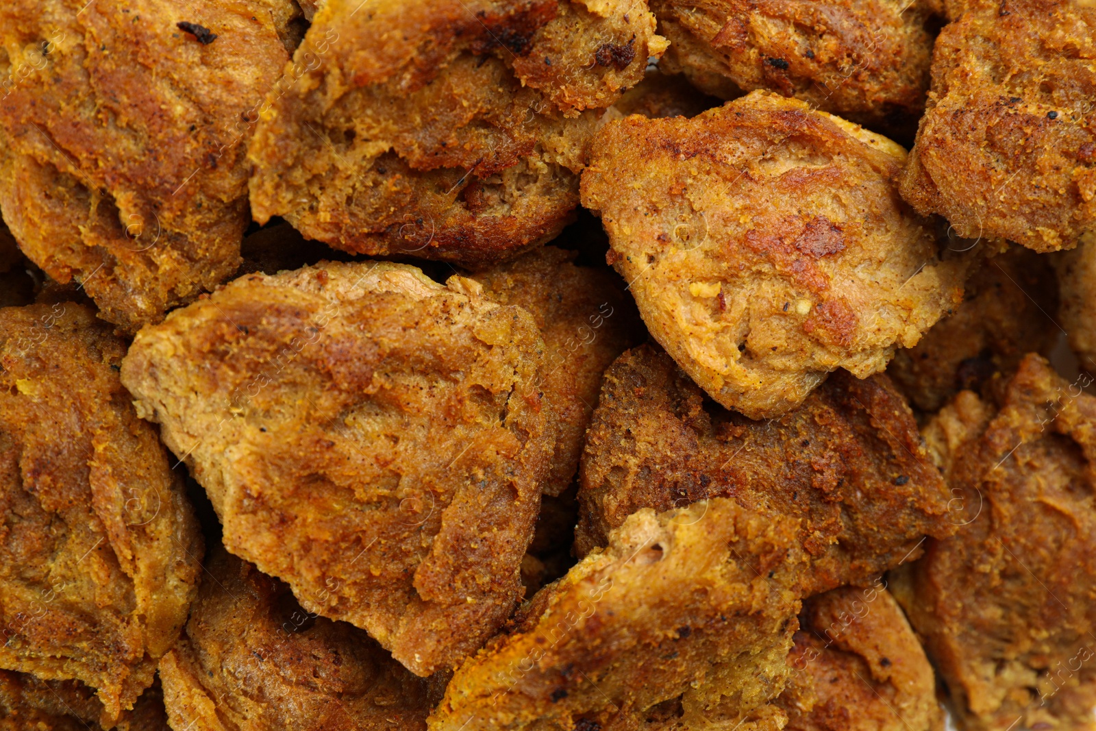 Photo of Delicious cooked soy meat as background, top view