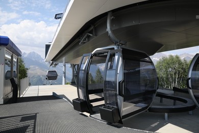 Modern large cabins on cableway near mountain outdoors