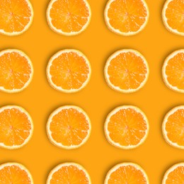 Image of Slices of fresh ripe tangerines on orange background, flat lay