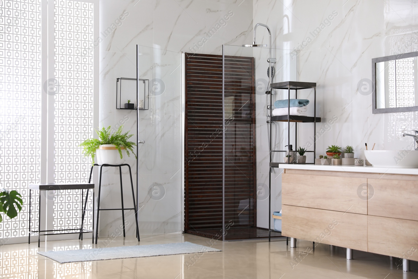 Photo of Bathroom interior with shower stall, counter and houseplants. Idea for design