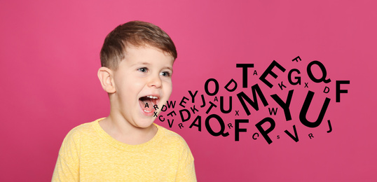 Image of Portrait of little boy with letters on pink background. Speech therapy concept
