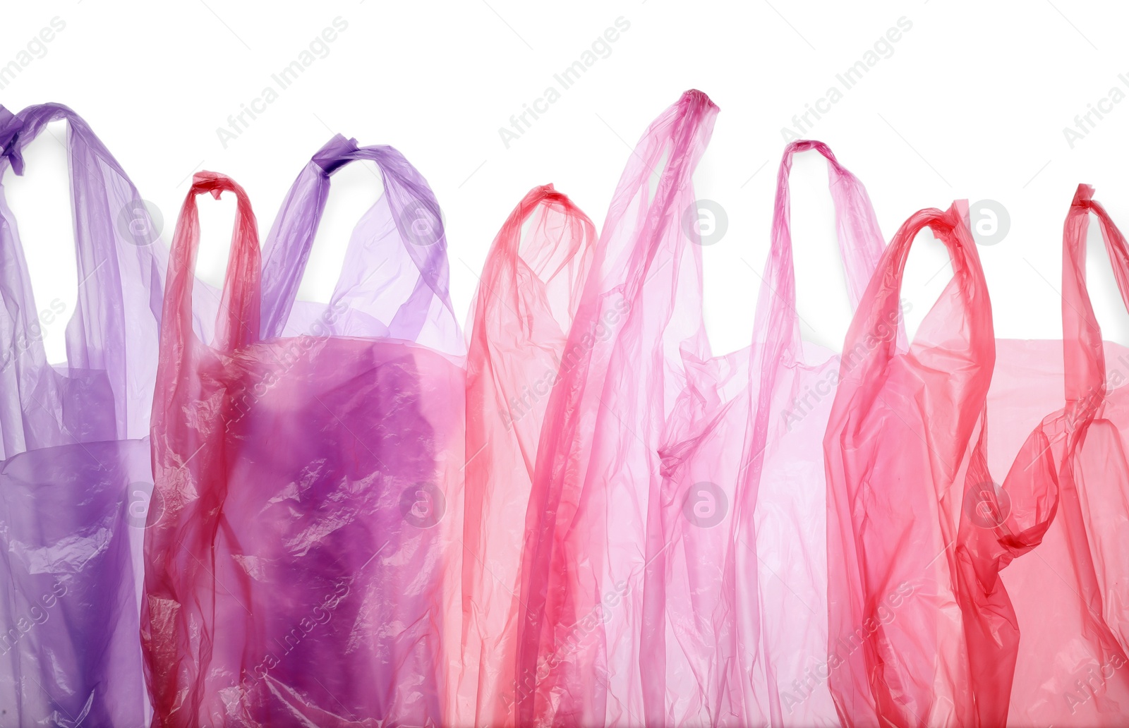 Photo of Many different plastic bags on white background