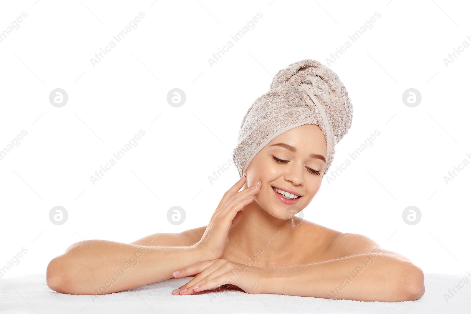 Photo of Portrait of young pretty woman with towel on white background