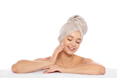 Portrait of young pretty woman with towel on white background