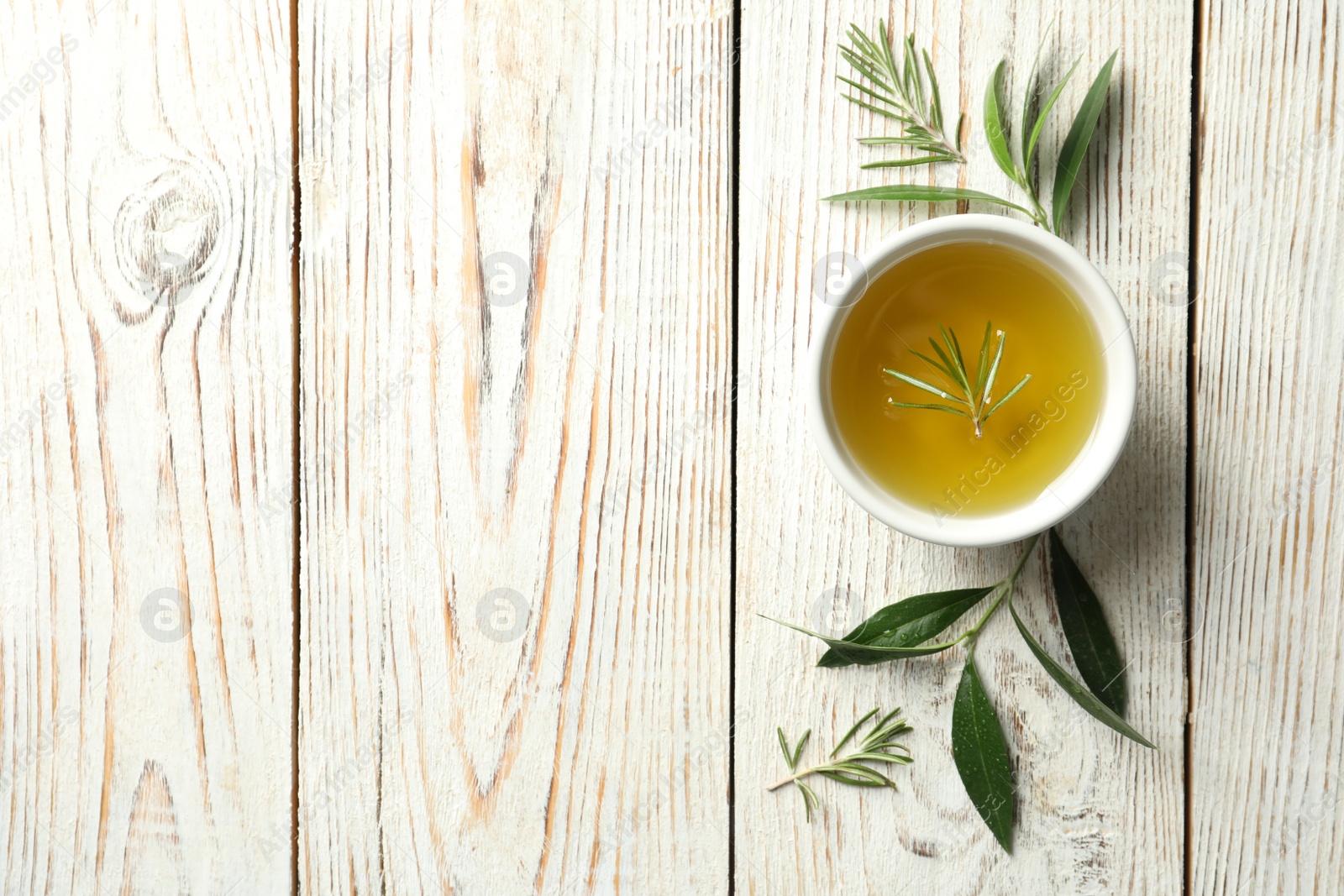 Photo of Flat lay composition with fresh olive oil on wooden background