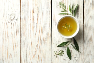 Photo of Flat lay composition with fresh olive oil on wooden background