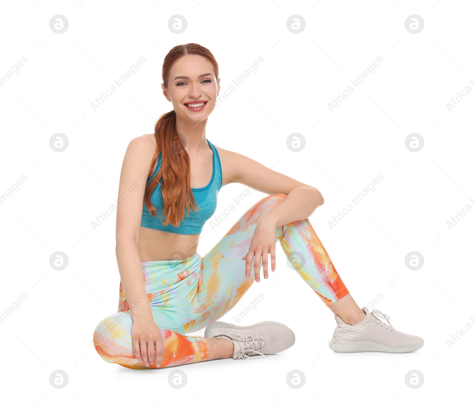 Photo of Young woman wearing sportswear on white background