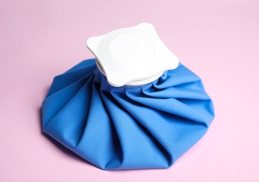 Photo of Ice pack on pink background. Cold compress