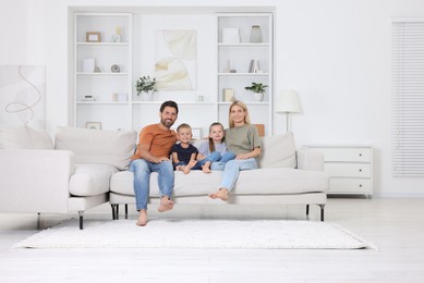 Photo of Portrait of happy family with children on sofa at home