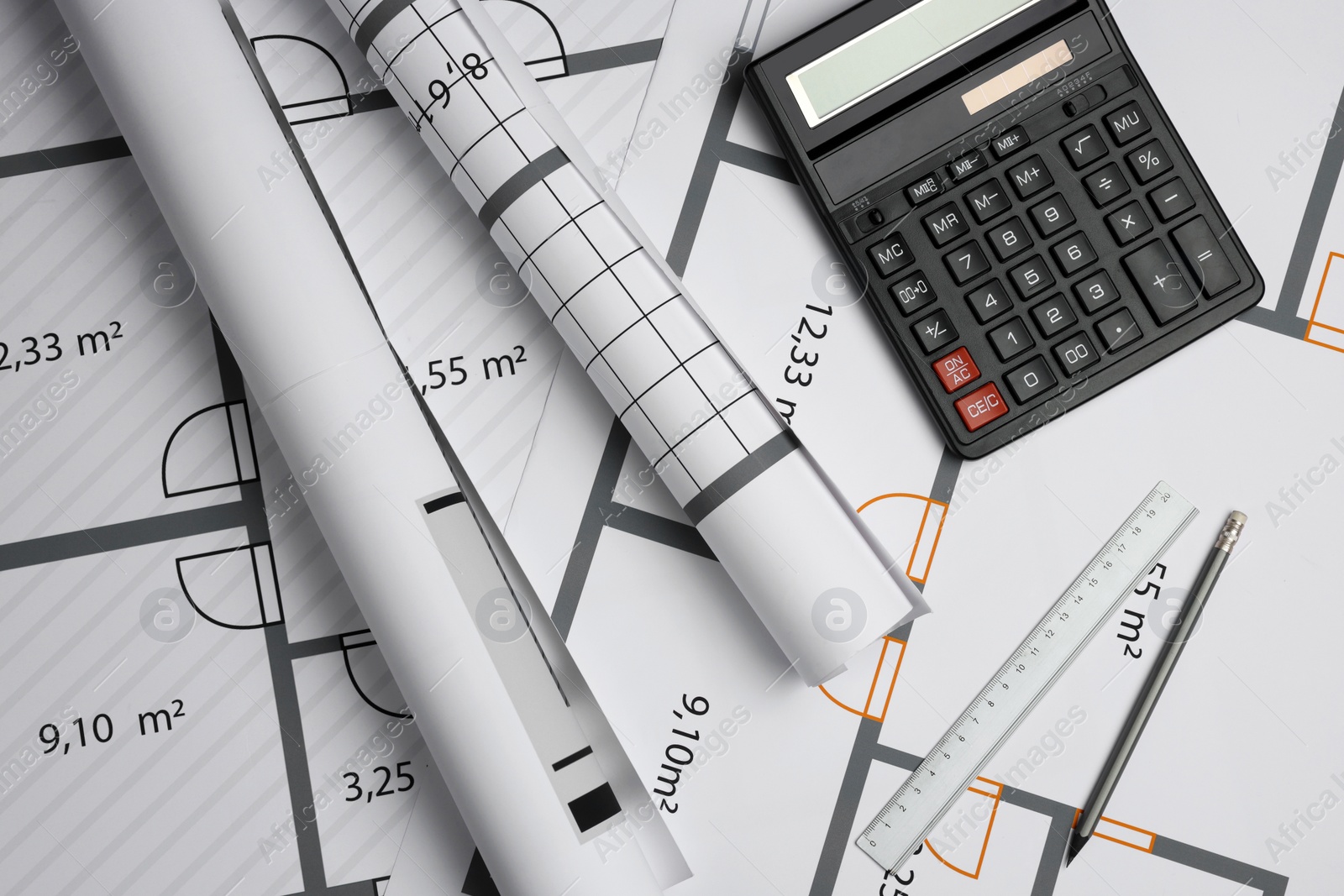 Photo of Construction drawings, ruler, pencil and calculator on house plan, flat lay. Architect workspace