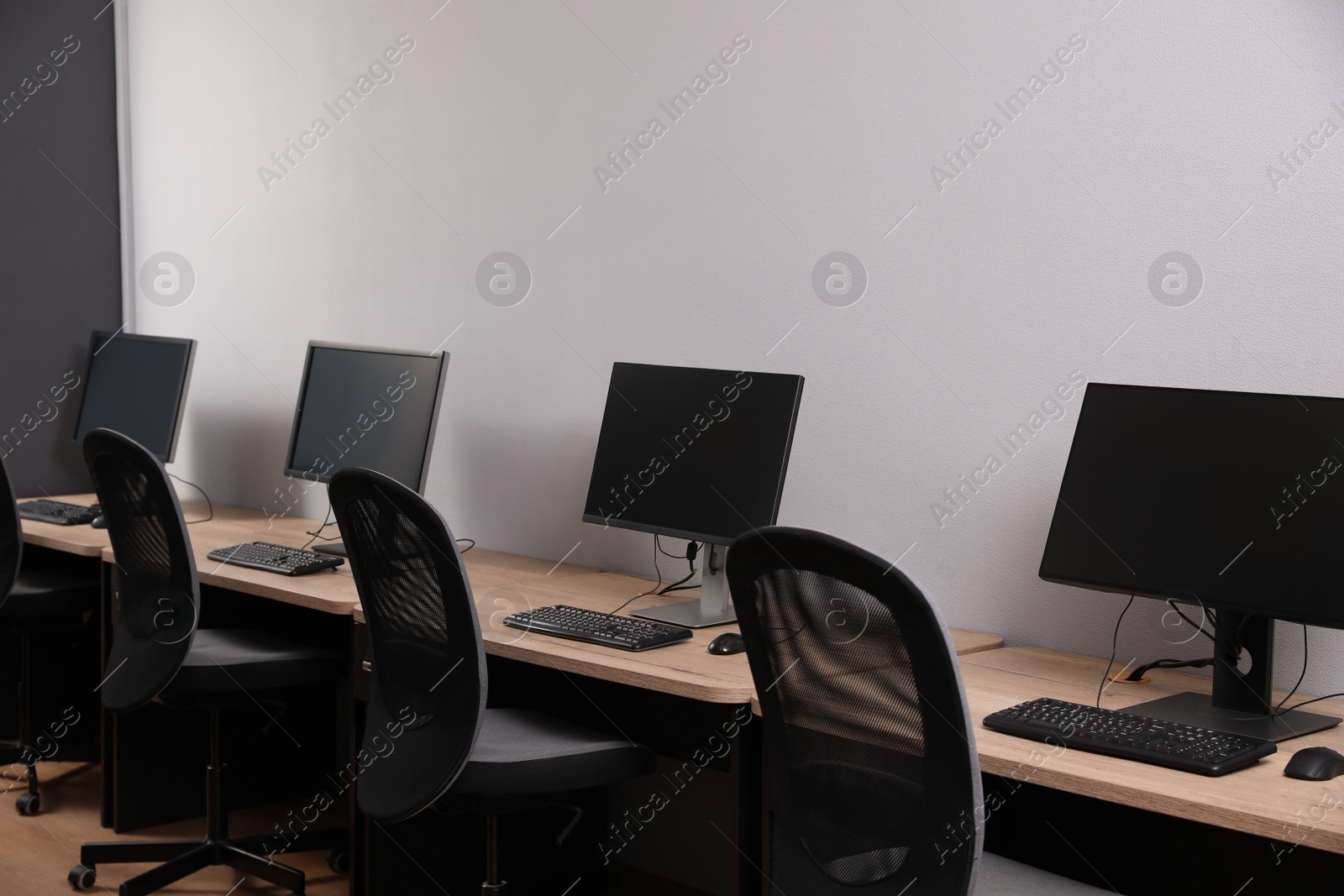 Photo of Many modern computers in open space office