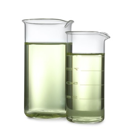 Glassware with liquids isolated on white. Laboratory analysis