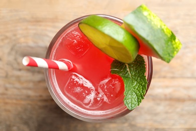 Delicious fresh watermelon drink on wooden table, top view