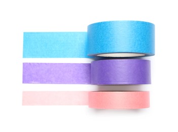 Different rolls of adhesive tape on white background, top view