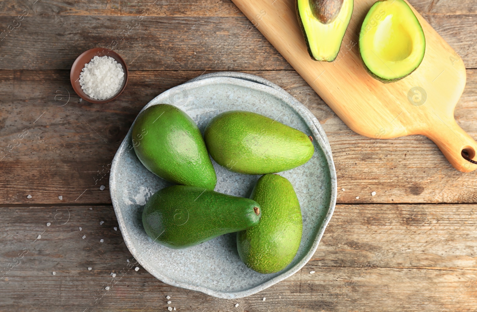 Photo of Flat lay composition with ripe avocados on wooden background