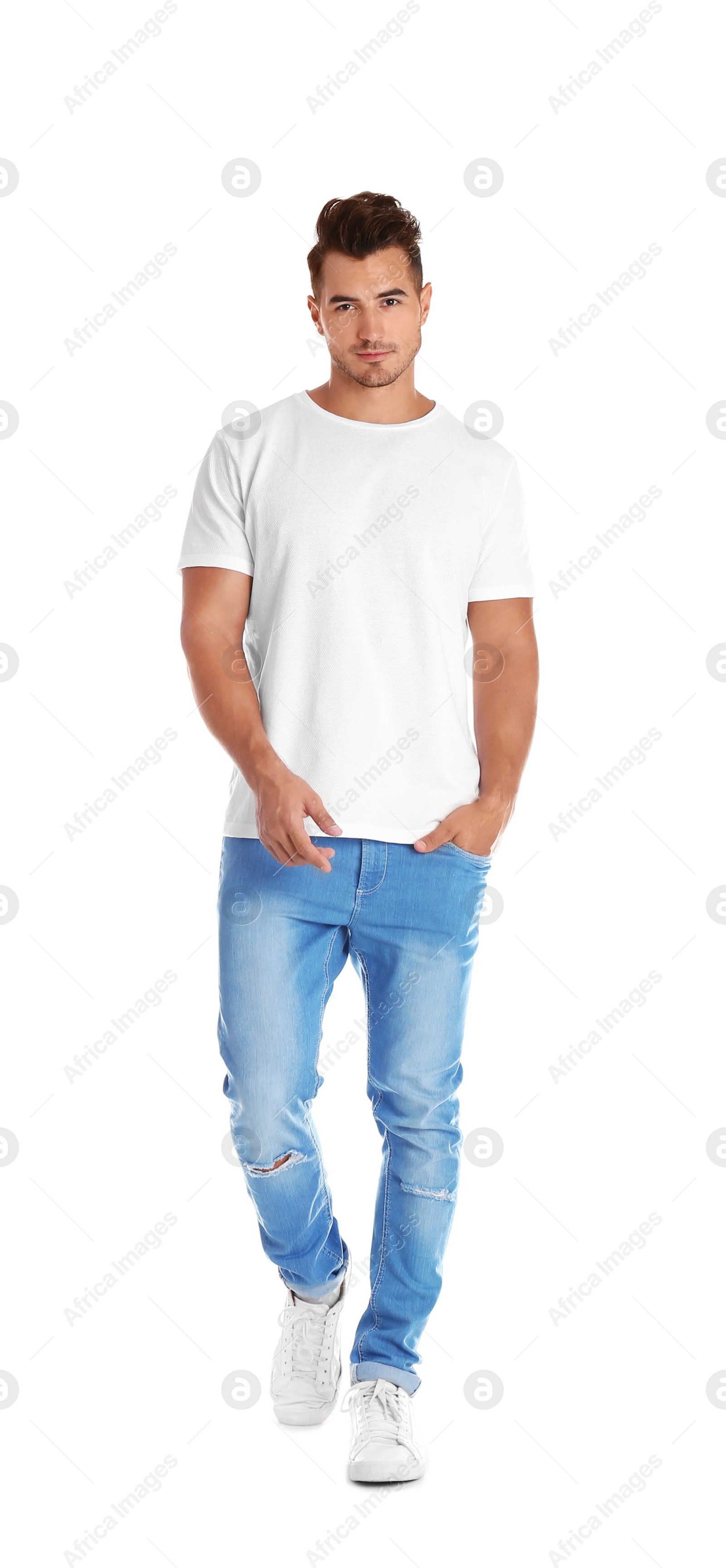 Photo of Young man in stylish jeans on white background