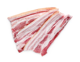 Photo of Slices of tasty pork fatback with spices on white background, top view