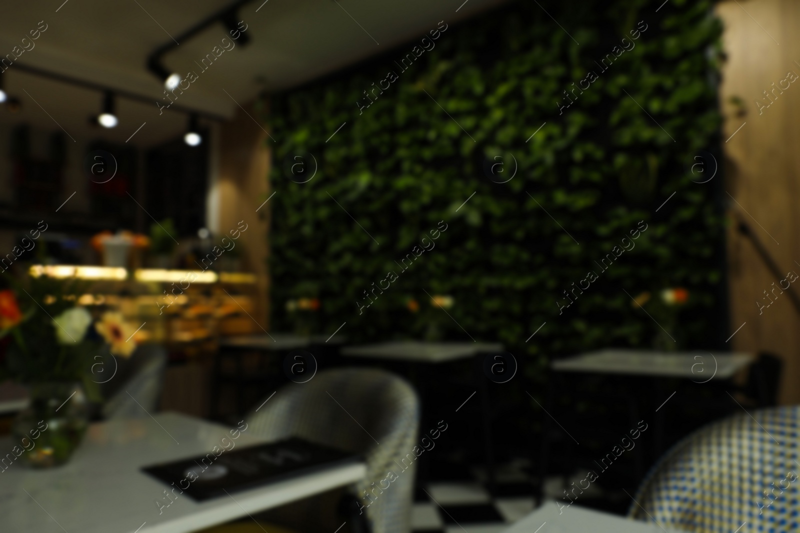 Photo of Stylish cafe interior with furniture, blurred view