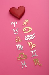 Photo of Zodiac compatibility. Signs with red heart on pink background, above view