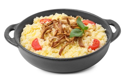 Photo of Frying pan of tasty couscous with mushrooms, basil and tomatoes on white background