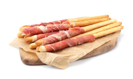 Photo of Delicious grissini sticks with prosciutto on white background