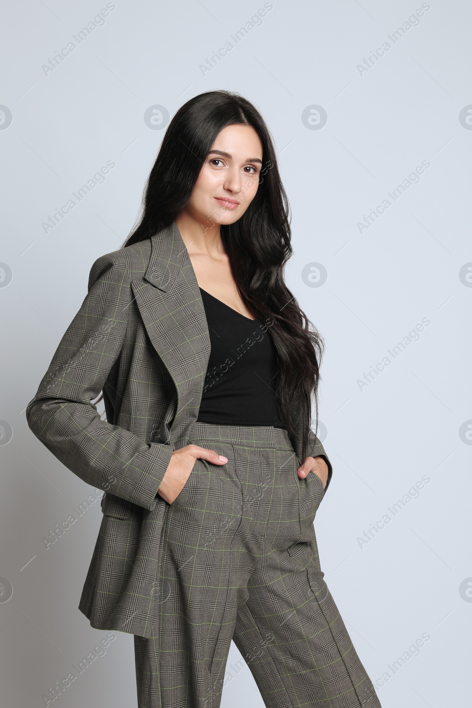 Photo of Beautiful woman in formal suit on white background. Business attire