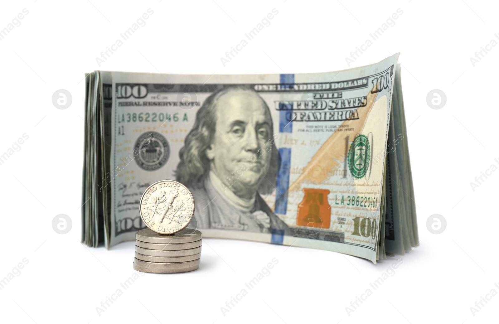 Photo of Dollar banknotes and stack of coins on white background