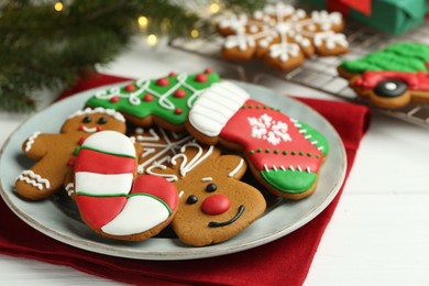 Tasty homemade Christmas cookies on white wooden table, closeup