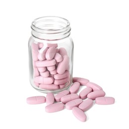 Photo of Bottle and pile of vitamin pills isolated on white