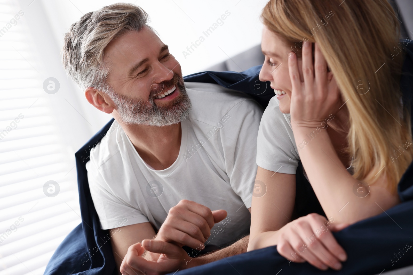 Photo of Lovely mature couple in bed at home