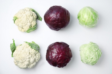 Photo of Flat lay composition with ripe cabbages on white background