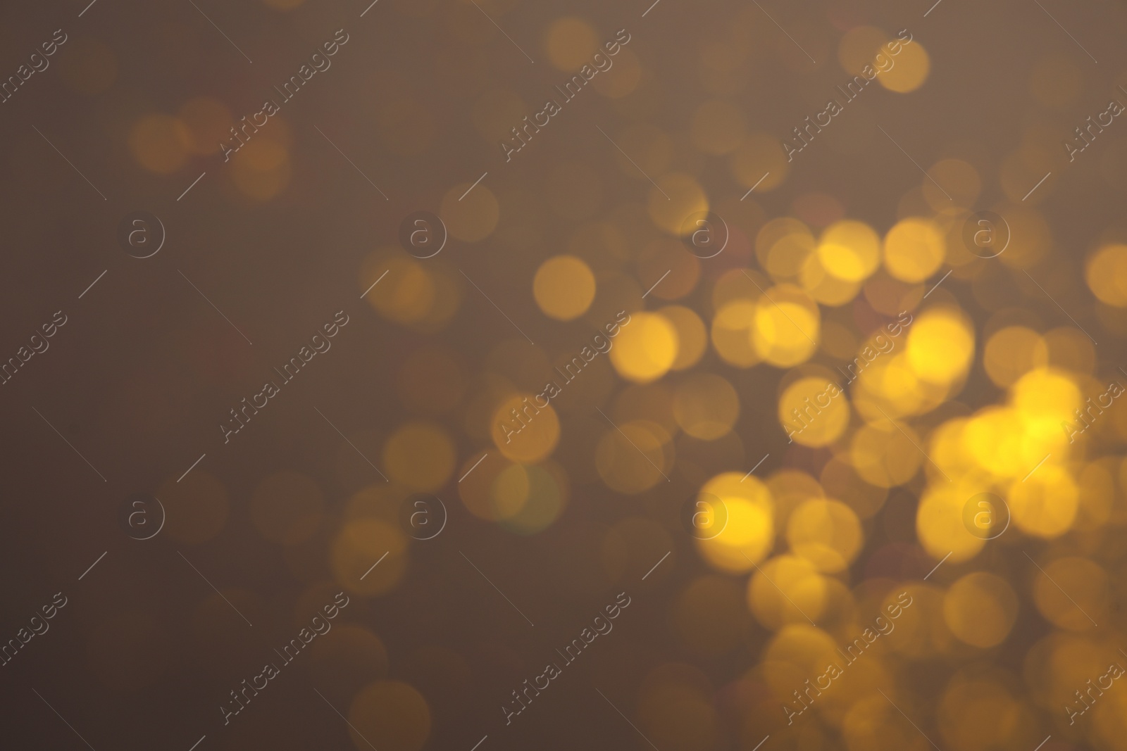 Photo of Blurred view of shiny lights on grey background. Bokeh effect