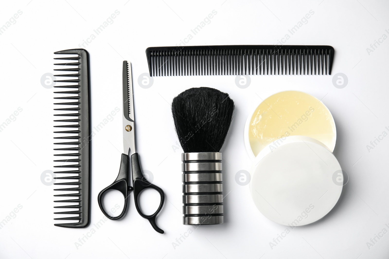 Photo of Professional hairstyling tools on white background, flat lay