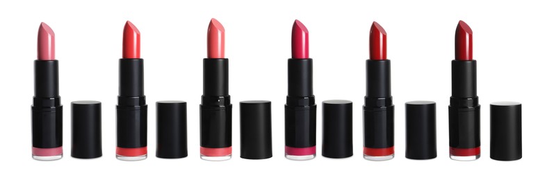 Set with different beautiful lipsticks on white background. Banner design