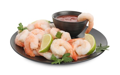 Photo of Tasty boiled shrimps with cocktail sauce, lime and parsley isolated on white