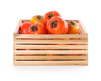 Photo of Delicious ripe juicy persimmons in wooden crate isolated on white